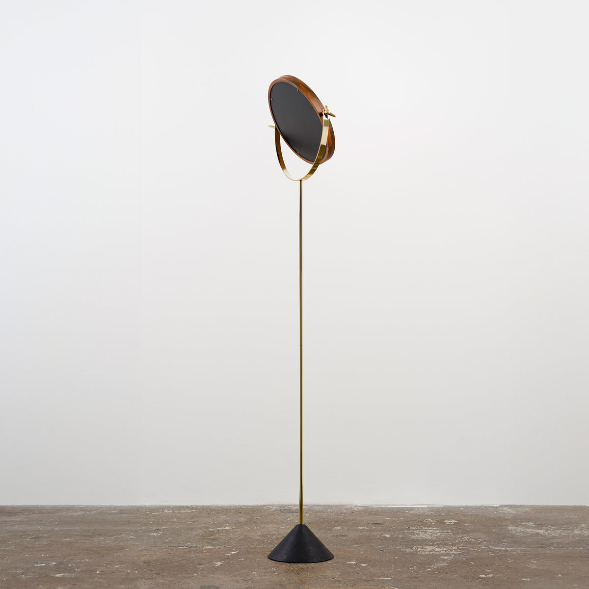 A floor mirror designed by Carl Auböck IV, made to order in the Auböck Werkstätte, Vienna, Austria. Originally conceived in the 1950s, this timeless piece exemplifies mid-century Austrian design and craftsmanship.