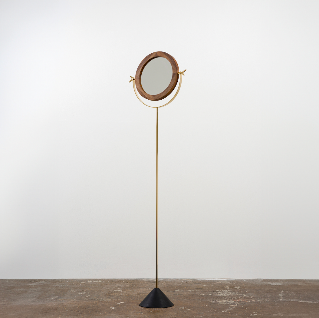 A floor mirror designed by Carl Auböck IV, made to order in the Auböck Werkstätte, Vienna, Austria. Originally conceived in the 1950s, this timeless piece exemplifies mid-century Austrian design and craftsmanship.