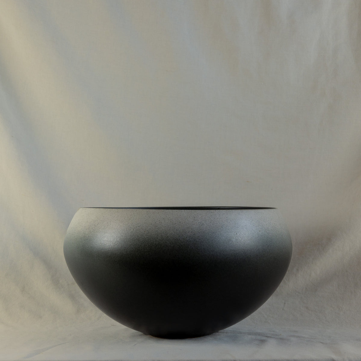 Large onion-shaped vase by Kasper Würtz, featuring a gradient grey glaze. This handcrafted ceramic piece showcases Würtz’s signature Nordic craftsmanship and organic form. Available at Sigmar London.