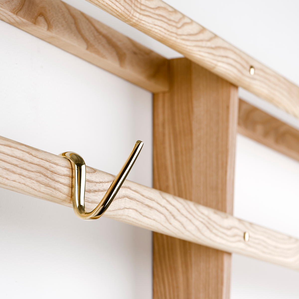 An S-hook designed by Carl Auböck, crafted in the Werkstätte Auböck workshop, Vienna, Austria. Made from brass and designed to be wardrobe-mounted, this piece reflects mid-century Austrian design and craftsmanship.