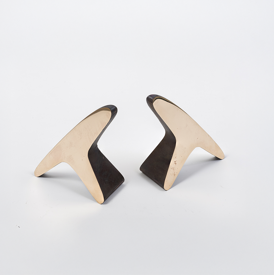 A pair of 'T' shaped bookends by Carl Auböck, crafted in the Werkstätte Auböck workshop, Austria, 1948. These bookends exemplify mid-century modern design and Austrian craftsmanship.