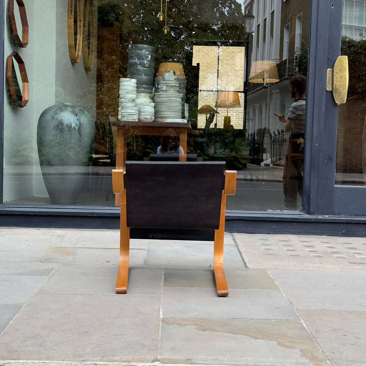 An Alvar Aalto-designed Finmar 31 armchair, featuring black curved plywood. This armchair is an iconic example of Finnish modernism, showcased by Sigmar Design Gallery in London.