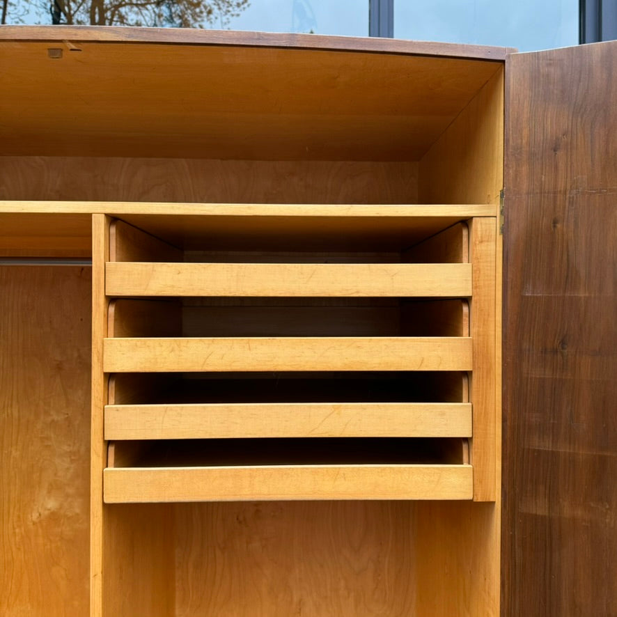 A large mahogany wardrobe designed in Denmark, retailed by Illums Bolighus, and attributed to Kaare Klint. This 1940s piece draws inspiration from Georgian design, showcasing exceptional Danish craftsmanship and timeless elegance.