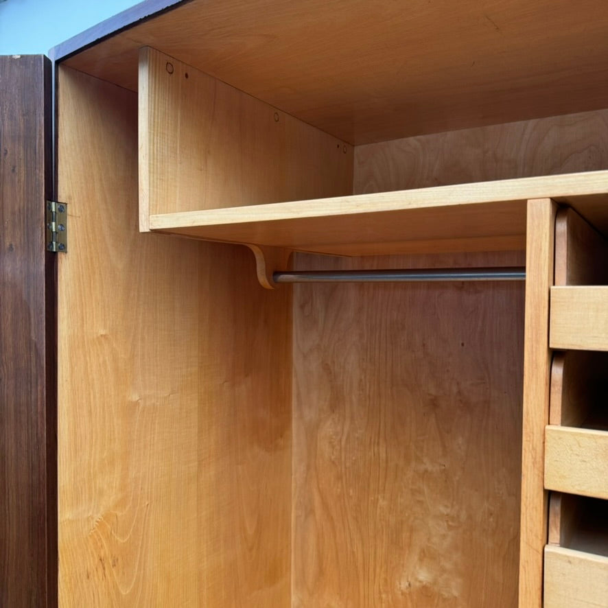 A large mahogany wardrobe designed in Denmark, retailed by Illums Bolighus, and attributed to Kaare Klint. This 1940s piece draws inspiration from Georgian design, showcasing exceptional Danish craftsmanship and timeless elegance.