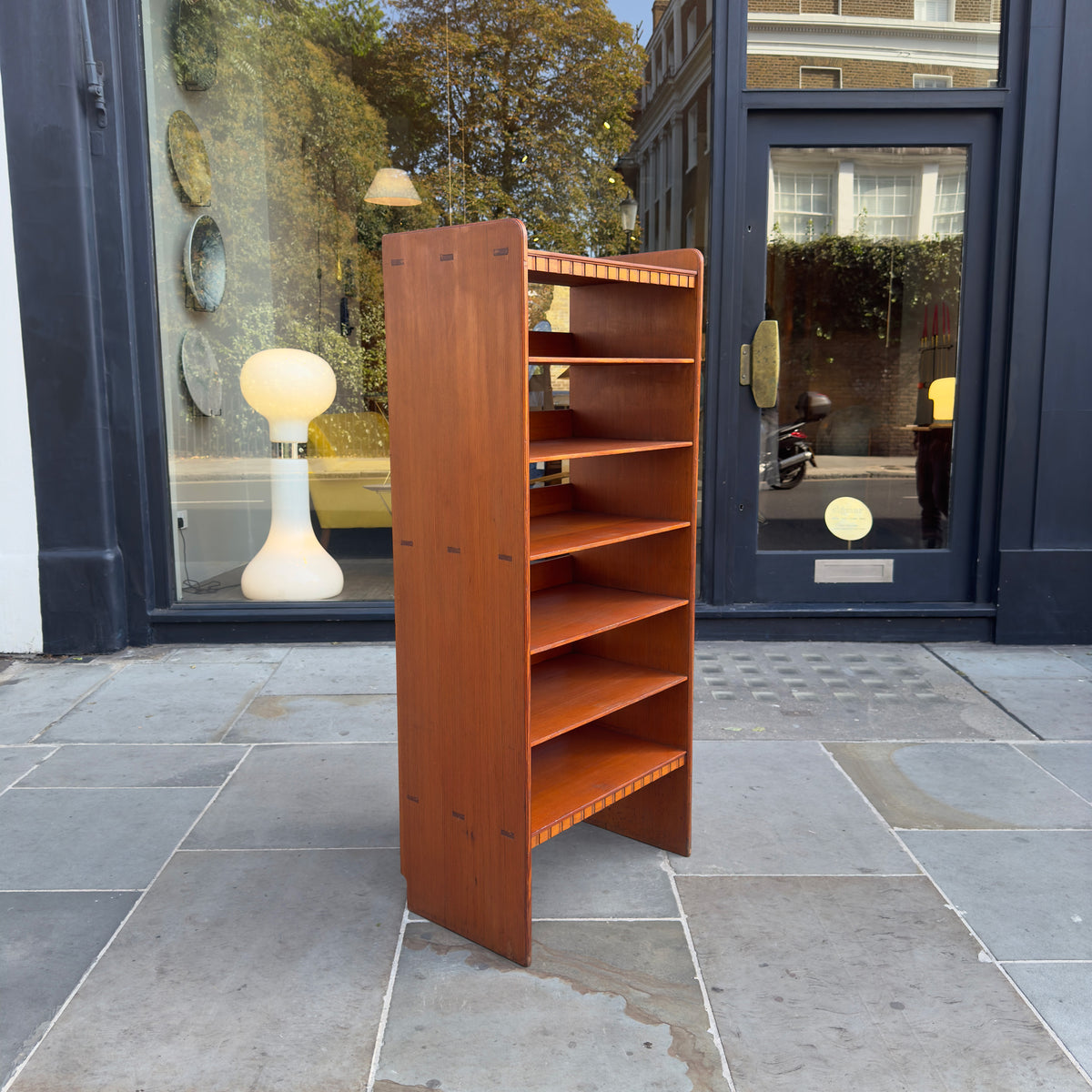 A Danish Art Nouveau bookcase in the Skonvirke style, crafted from pine and made for the Copenhagen Town Hall by Rasmussen and designed by Martin Nyrop. This piece exemplifies early 20th-century Danish craftsmanship.