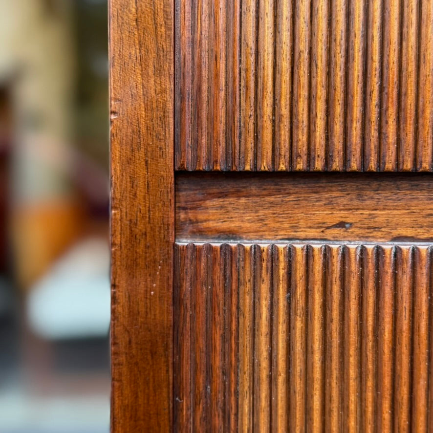 A large mahogany wardrobe designed in Denmark, retailed by Illums Bolighus, and attributed to Kaare Klint. This 1940s piece draws inspiration from Georgian design, showcasing exceptional Danish craftsmanship and timeless elegance.