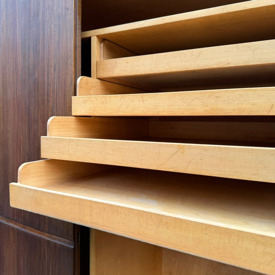 A large mahogany wardrobe designed in Denmark, retailed by Illums Bolighus, and attributed to Kaare Klint. This 1940s piece draws inspiration from Georgian design, showcasing exceptional Danish craftsmanship and timeless elegance.