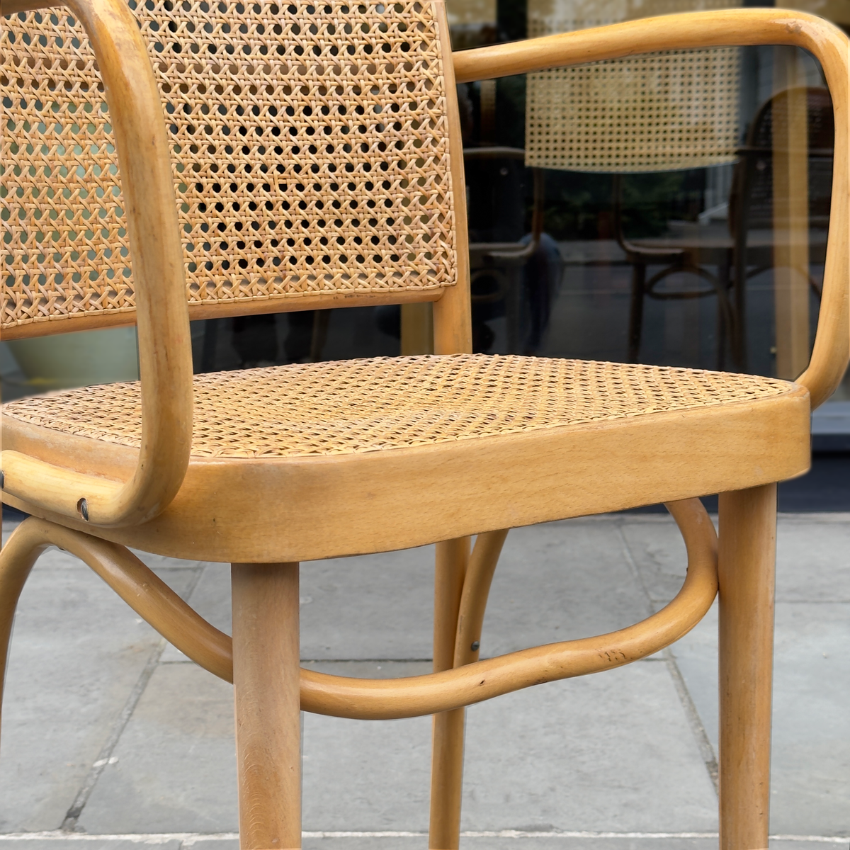 A pair of vintage Josef Hoffmann carver’s chairs, showcased at Sigmar London. These elegantly crafted chairs feature Hoffmann’s signature geometric design, with finely detailed woodwork and a timeless aesthetic reflecting early 20th-century Viennese craftsmanship."