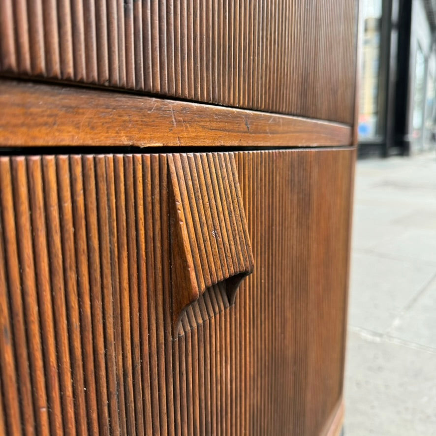 A large mahogany wardrobe designed in Denmark, retailed by Illums Bolighus, and attributed to Kaare Klint. This 1940s piece draws inspiration from Georgian design, showcasing exceptional Danish craftsmanship and timeless elegance.