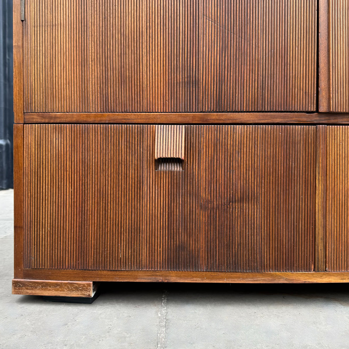 A large mahogany wardrobe designed in Denmark, retailed by Illums Bolighus, and attributed to Kaare Klint. This 1940s piece draws inspiration from Georgian design, showcasing exceptional Danish craftsmanship and timeless elegance.