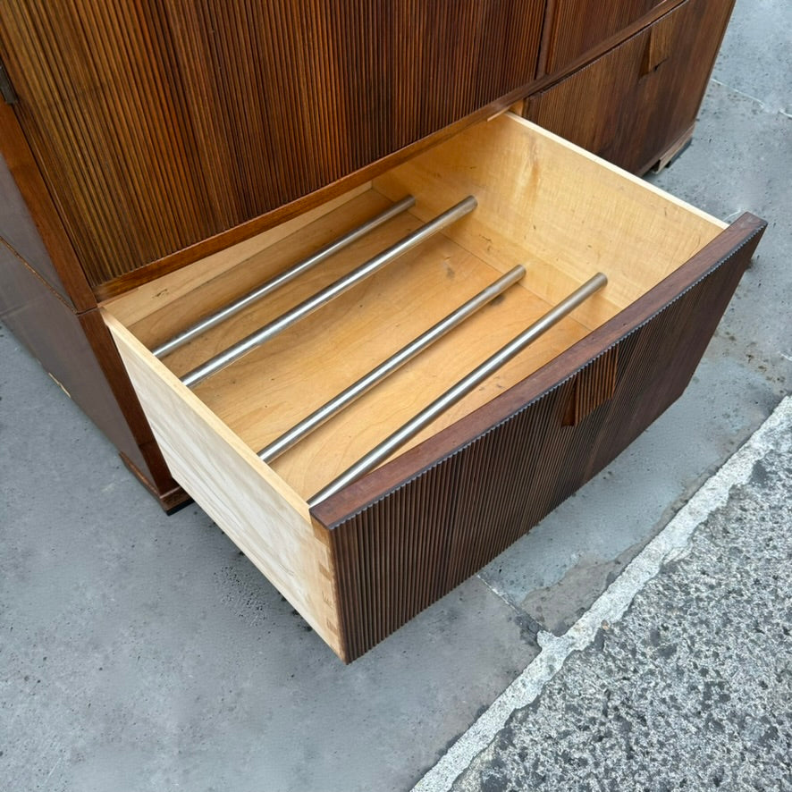 A large mahogany wardrobe designed in Denmark, retailed by Illums Bolighus, and attributed to Kaare Klint. This 1940s piece draws inspiration from Georgian design, showcasing exceptional Danish craftsmanship and timeless elegance.