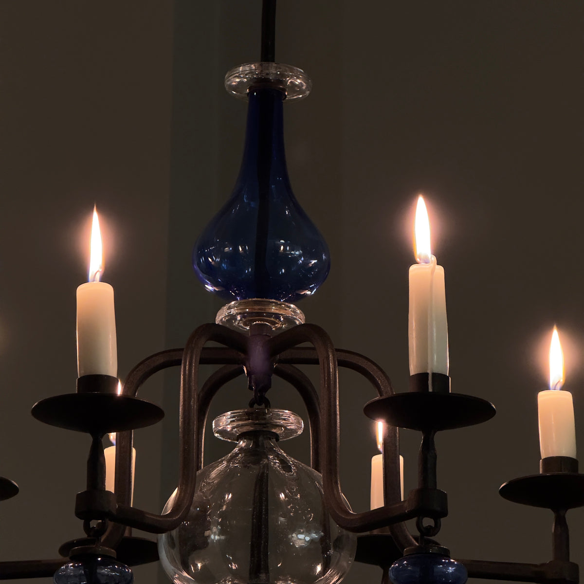 A 1960s blue chandelier by Erik Höglund, featuring pressed glass fish details and an iron frame. Crafted for Boda in Sweden, this vintage piece is available from Sigmar and exemplifies mid-century Scandinavian design.