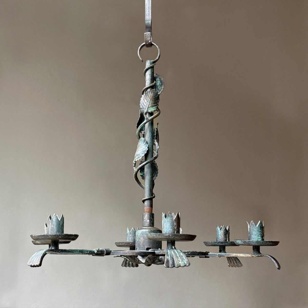 A 1930s Swedish Grace floral chandelier crafted from wrought iron. This vintage piece, available from Sigmar, embodies the refined elegance and craftsmanship of the Swedish Grace movement.