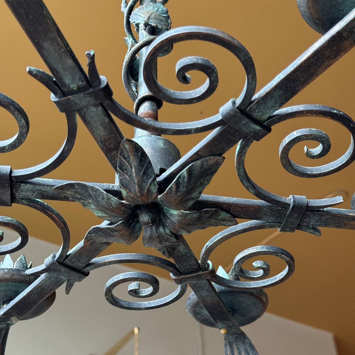 A 1930s Swedish Grace floral chandelier crafted from wrought iron. This vintage piece, available from Sigmar, embodies the refined elegance and craftsmanship of the Swedish Grace movement.