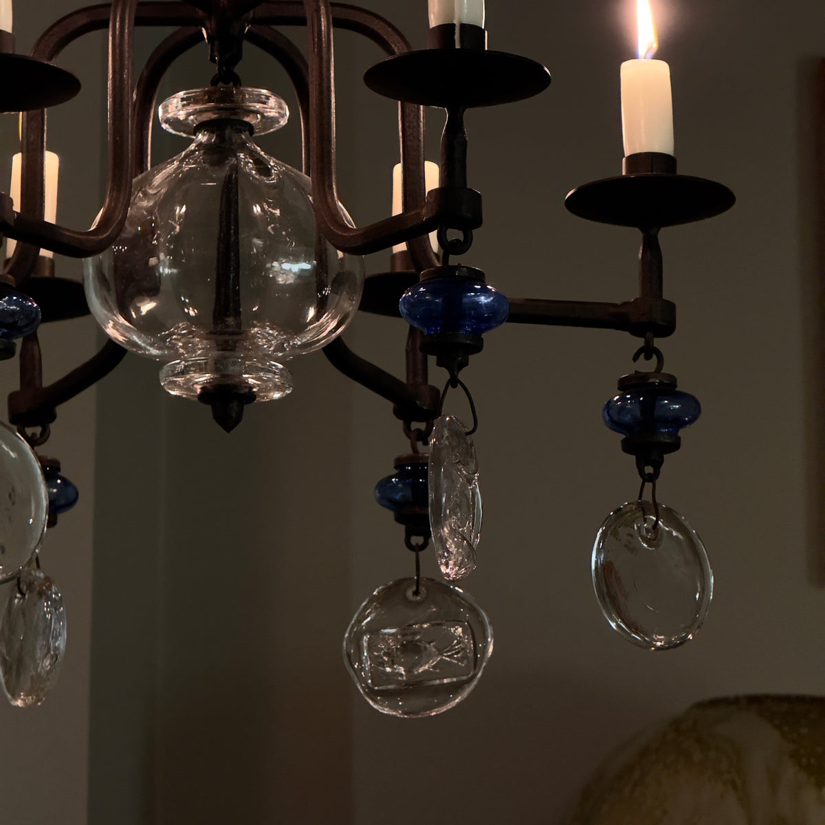 A 1960s blue chandelier by Erik Höglund, featuring pressed glass fish details and an iron frame. Crafted for Boda in Sweden, this vintage piece is available from Sigmar and exemplifies mid-century Scandinavian design.