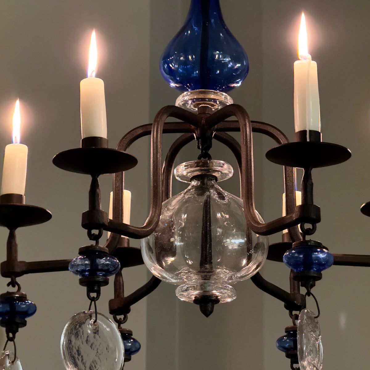 A 1960s blue chandelier by Erik Höglund, featuring pressed glass fish details and an iron frame. Crafted for Boda in Sweden, this vintage piece is available from Sigmar and exemplifies mid-century Scandinavian design.