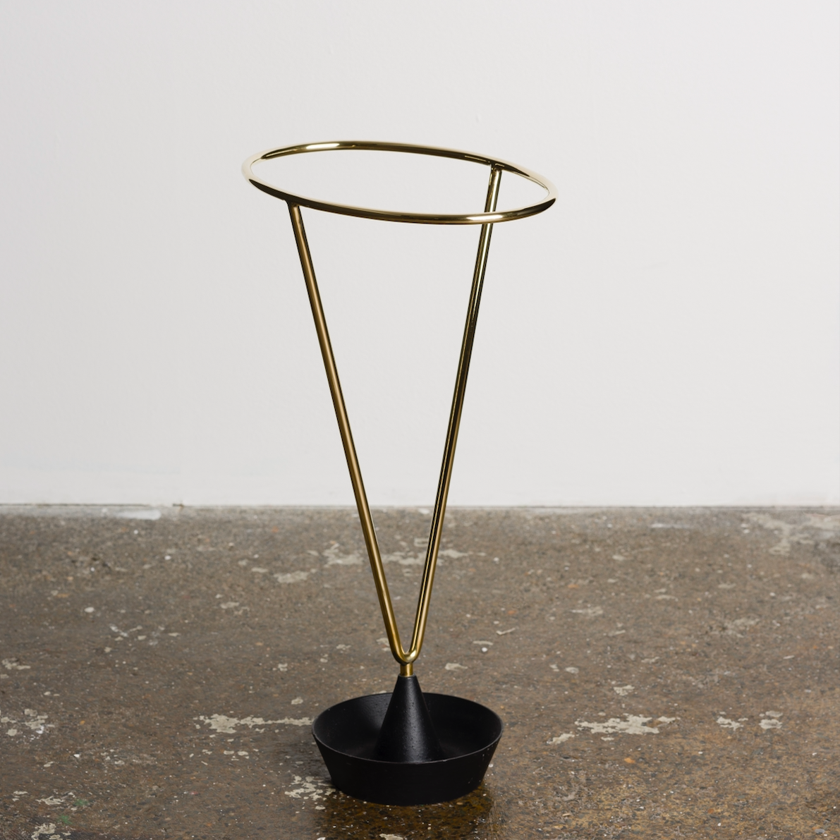 An umbrella stand designed by Carl Auböck, crafted in the Werkstätte Auböck workshop in Austria, 1955. This piece highlights mid-century Austrian craftsmanship and functional modernist design.