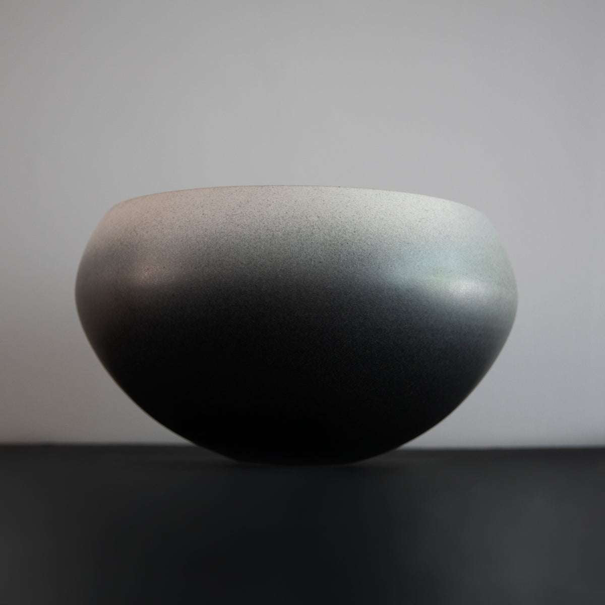 Large onion-shaped vase by Kasper Würtz, featuring a gradient grey glaze. This handcrafted ceramic piece showcases Würtz’s signature Nordic craftsmanship and organic form. Available at Sigmar London.