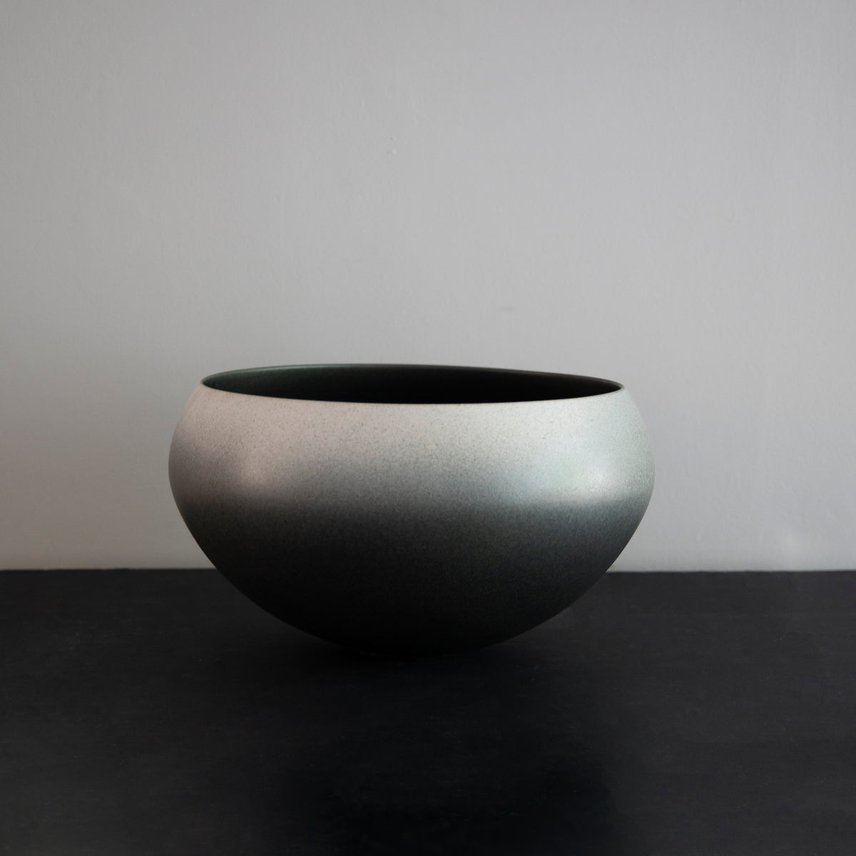 Large onion-shaped vase by Kasper Würtz, featuring a gradient grey glaze. This handcrafted ceramic piece showcases Würtz’s signature Nordic craftsmanship and organic form. Available at Sigmar London.