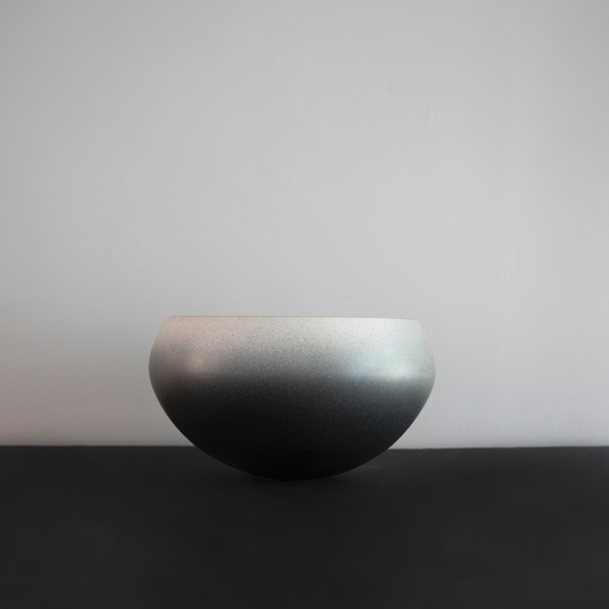 Large onion-shaped vase by Kasper Würtz, featuring a gradient grey glaze. This handcrafted ceramic piece showcases Würtz’s signature Nordic craftsmanship and organic form. Available at Sigmar London.