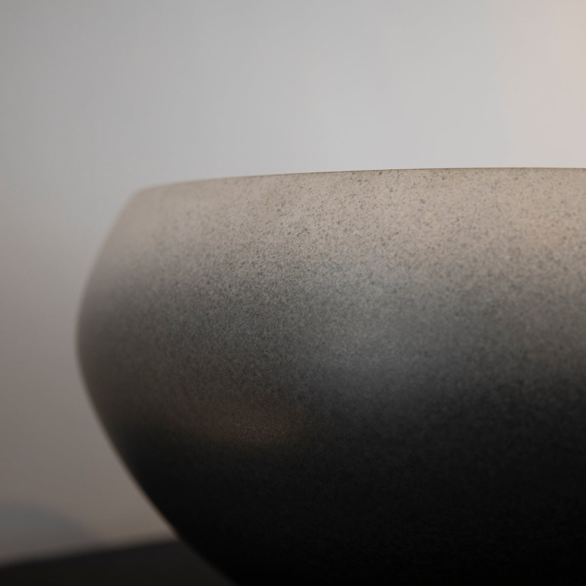 Large onion-shaped vase by Kasper Würtz, featuring a gradient grey glaze. This handcrafted ceramic piece showcases Würtz’s signature Nordic craftsmanship and organic form. Available at Sigmar London.