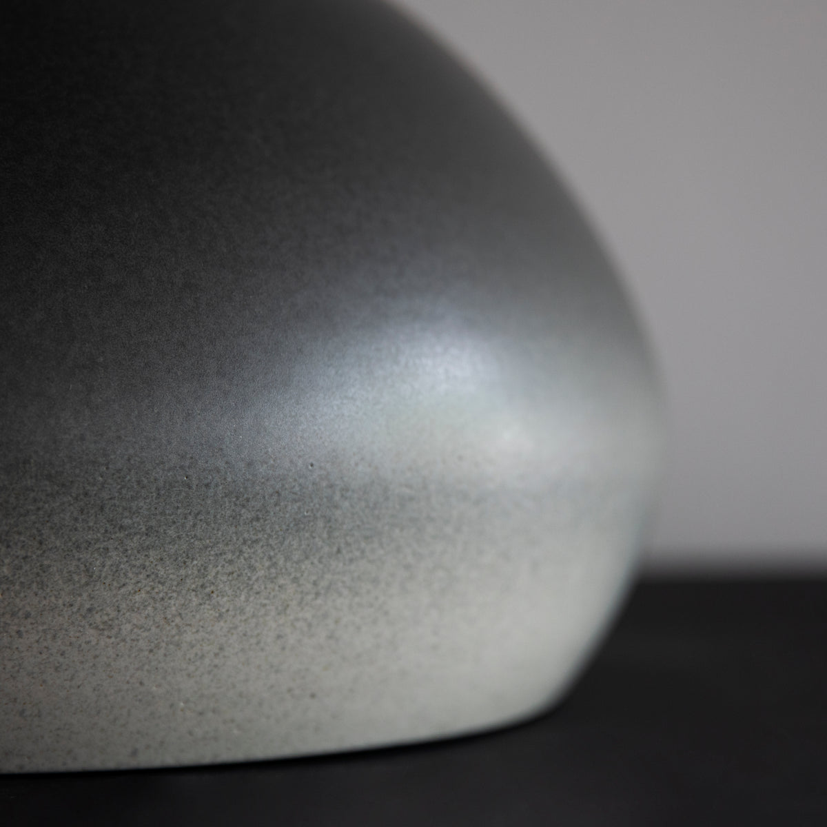 Large onion-shaped vase by Kasper Würtz, featuring a gradient grey glaze. This handcrafted ceramic piece showcases Würtz’s signature Nordic craftsmanship and organic form. Available at Sigmar London.