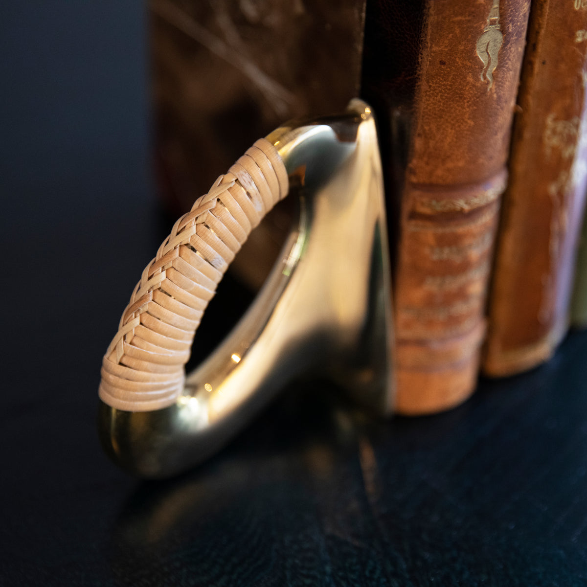 A pair of polished brass flat iron bookends by Carl Auböck, crafted in the Werkstätte Auböck workshop, Austria, 1943. These bookends showcase timeless mid-century Austrian design and exceptional craftsmanship.