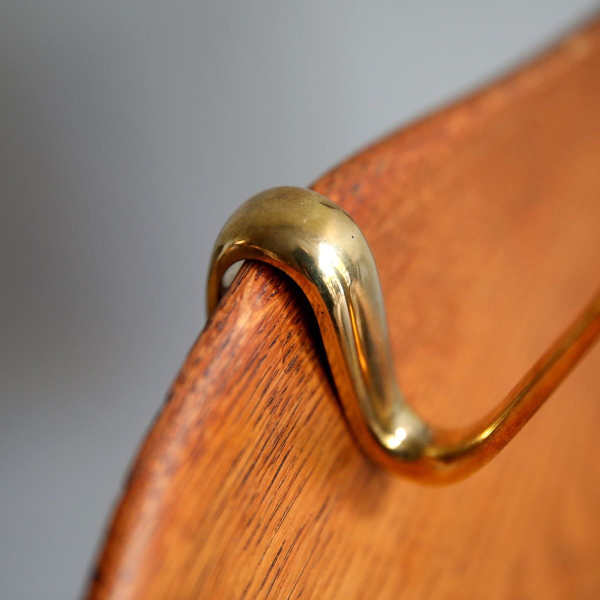 An S-hook designed by Carl Auböck, crafted in the Werkstätte Auböck workshop, Vienna, Austria. Made from brass and designed to be wardrobe-mounted, this piece reflects mid-century Austrian design and craftsmanship.