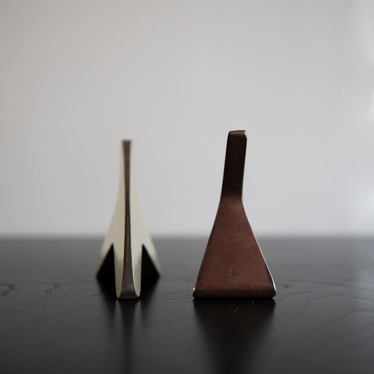 A pair of 'T' shaped bookends by Carl Auböck, crafted in the Werkstätte Auböck workshop, Austria, 1948. These bookends exemplify mid-century modern design and Austrian craftsmanship.