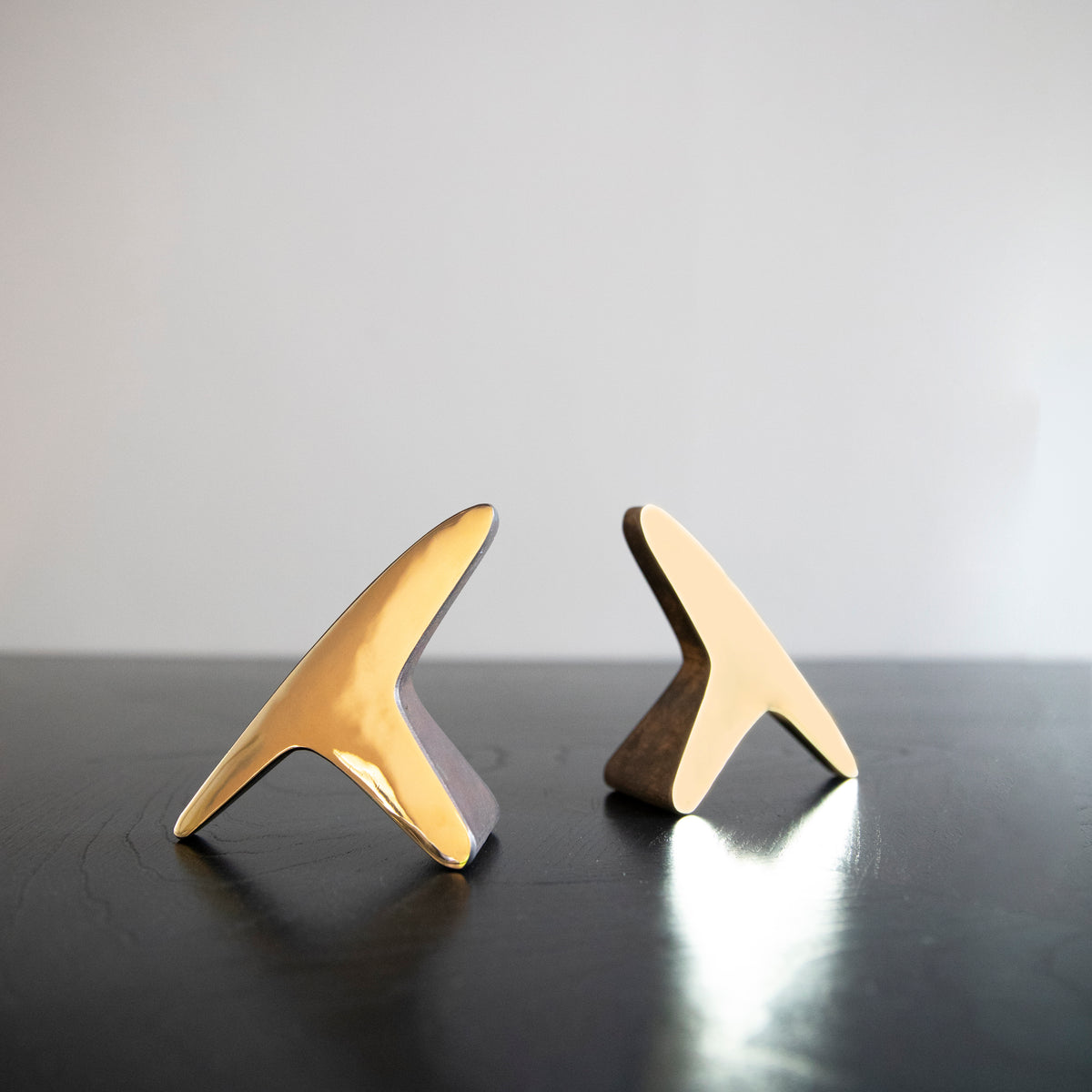 A pair of 'T' shaped bookends by Carl Auböck, crafted in the Werkstätte Auböck workshop, Austria, 1948. These bookends exemplify mid-century modern design and Austrian craftsmanship.