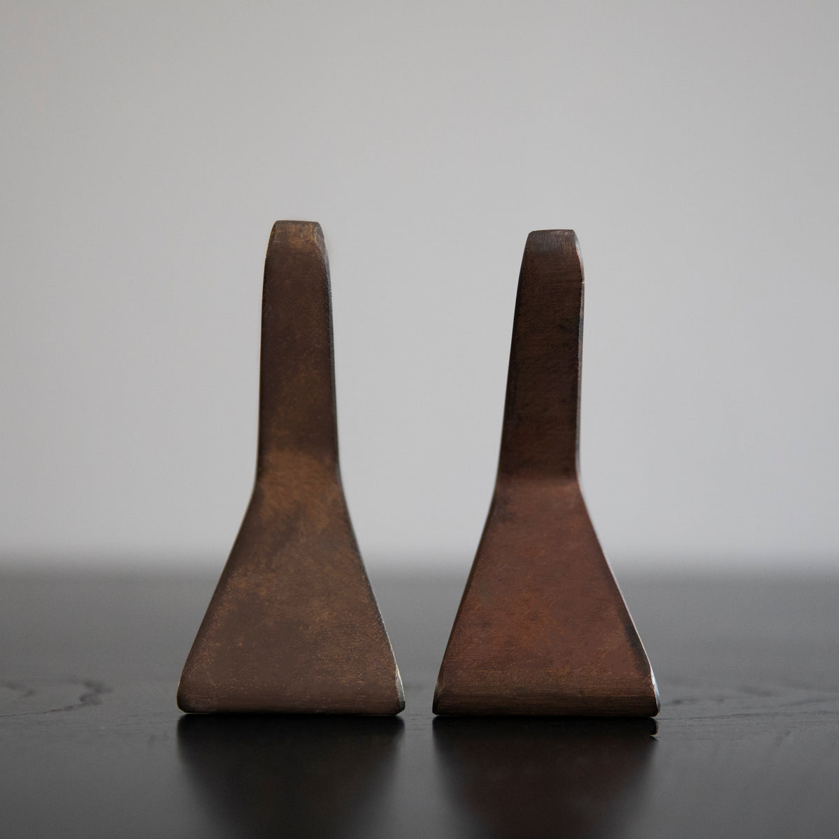 A pair of 'T' shaped bookends by Carl Auböck, crafted in the Werkstätte Auböck workshop, Austria, 1948. These bookends exemplify mid-century modern design and Austrian craftsmanship.