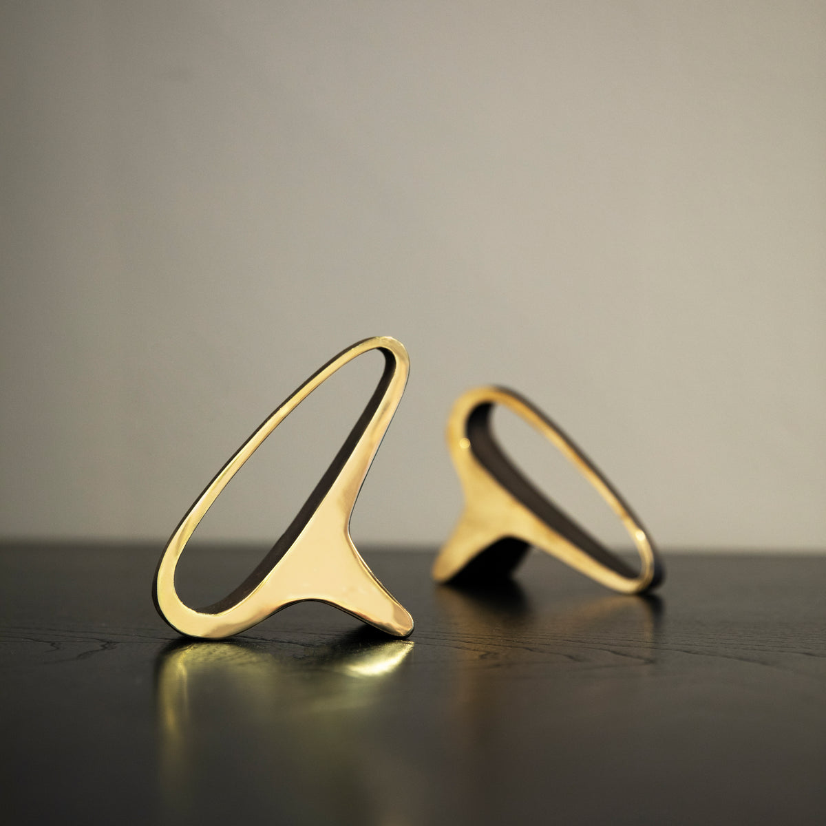 A brass earlobe-shaped bookend by Carl Auböck, crafted in the Werkstätte Auböck workshop and available at Sigmar London. This midcentury design piece exemplifies the innovative and artistic craftsmanship of Austrian modernism.